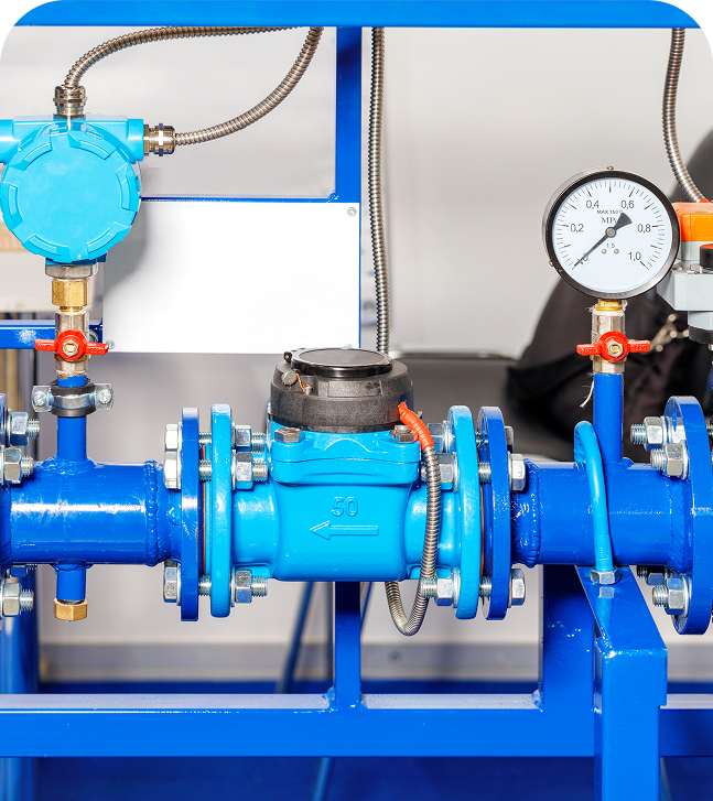 Blue industrial pipeline with pressure gauge.