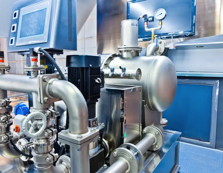 Group 678 (2) Industrial machinery with pipes and control panel.