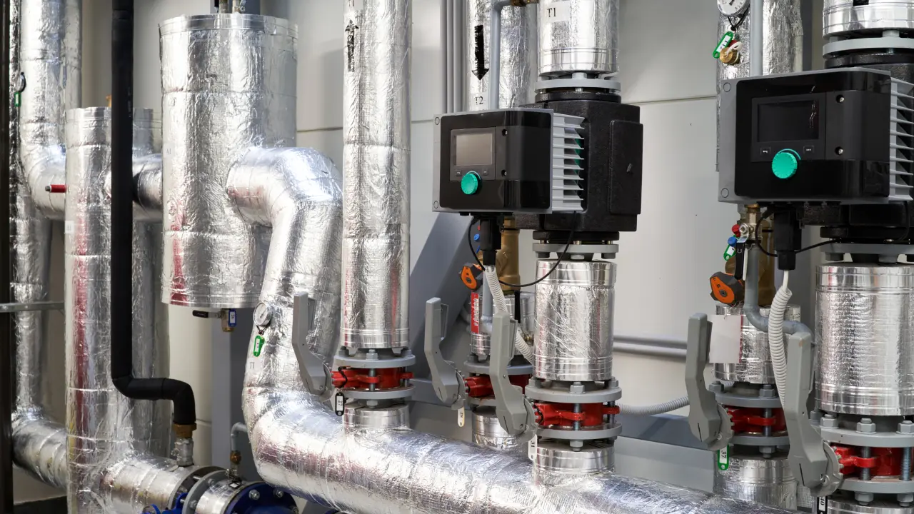 New Project - 2025-04-22T185003.097 Insulated industrial pipes with control valves.