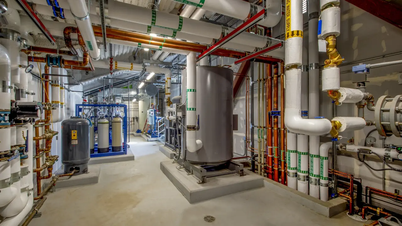 New Project - 2025-04-22T185149.596 Industrial boiler room with pipes and tanks.